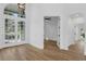 Bright living room with hardwood floors and large windows offering abundant natural light and an open floor plan at 460 W Palm Valley Dr, Oviedo, FL 32765