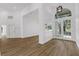 Bright living room with hardwood floors and large windows offering abundant natural light and an open floor plan at 460 W Palm Valley Dr, Oviedo, FL 32765