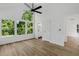 Bright main bedroom featuring high ceilings, large windows with a view, and ensuite bathroom access at 460 W Palm Valley Dr, Oviedo, FL 32765