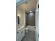 Modern bathroom featuring a bathtub with gray tiling and a white vanity at 5110 Sw 158Th St, Ocala, FL 34473