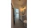 Bathroom boasts stylish vanity with black hardware and modern lighting fixtures at 5110 Sw 158Th St, Ocala, FL 34473