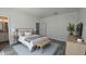 Stylishly furnished bedroom featuring gray wood-look floors and tasteful modern decor at 5110 Sw 158Th St, Ocala, FL 34473