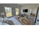 Cozy staged bedroom with television and good natural light from large windows at 5110 Sw 158Th St, Ocala, FL 34473