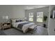 Cozy bedroom with two bright windows, a stylish rug, and neutral tones at 5110 Sw 158Th St, Ocala, FL 34473