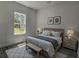 Beautifully staged bedroom with a cozy rug, a bench, and tasteful decor at 5110 Sw 158Th St, Ocala, FL 34473