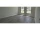 Bright bedroom with gray flooring and two windows offering lots of natural light at 5110 Sw 158Th St, Ocala, FL 34473