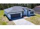 Lovely single Gathering home featuring a paved driveway and manicured lawn, providing great curb appeal to the house at 5110 Sw 158Th St, Ocala, FL 34473