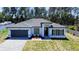 Charming single Gathering home boasting a well maintained lawn and landscaped front yard with a paved driveway at 5110 Sw 158Th St, Ocala, FL 34473