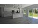 Bright kitchen featuring white cabinets, stainless steel appliances, and view to the backyard at 5110 Sw 158Th St, Ocala, FL 34473
