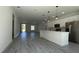 Open-concept living area featuring recessed lighting and luxury vinyl plank flooring with an island kitchen at 5110 Sw 158Th St, Ocala, FL 34473