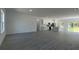 Spacious open-concept living area and kitchen with recessed lighting and luxury vinyl plank flooring at 5110 Sw 158Th St, Ocala, FL 34473
