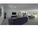 Stylish living room leading to an open kitchen, dining area, and sliding doors to the back at 5110 Sw 158Th St, Ocala, FL 34473