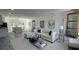 Comfortable living room leading into an open kitchen and dining area with great natural light at 5110 Sw 158Th St, Ocala, FL 34473
