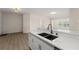 Modern kitchen featuring bright counters, stainless steel appliances, and a double sink at 5447 Vineland Rd # 1308, Orlando, FL 32811