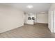 Spacious living room showcasing the modern kitchen, offering an open layout for seamless entertaining at 5447 Vineland Rd # 1308, Orlando, FL 32811