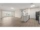 Bright living space with hardwood floors and lots of natural light, leading into an open kitchen concept at 5447 Vineland Rd # 1308, Orlando, FL 32811
