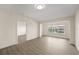 Bright open living room with lots of natural light and hardwood floors at 5447 Vineland Rd # 1308, Orlando, FL 32811