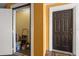 Utility space next to front door with some painting supplies and a stepladder at 5447 Vineland Rd # 1308, Orlando, FL 32811