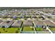 An aerial view showcasing the home's backyard with a white fence within a well-planned neighborhood at 5857 Beefmaster Rd, St Cloud, FL 34771