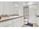 Bright bathroom with a single vanity, decorative mirror and a combined shower and tub at 5857 Beefmaster Rd, St Cloud, FL 34771