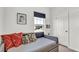 Daybed with colorful pillows in a bright room, complemented by modern decor at 5857 Beefmaster Rd, St Cloud, FL 34771