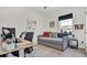 Bedroom with a study area, daybed, and modern décor elements for a functional space at 5857 Beefmaster Rd, St Cloud, FL 34771