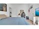 Bright bedroom featuring a workspace, hardwood floors, and a basketball hoop for recreation at 5857 Beefmaster Rd, St Cloud, FL 34771