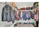 Walk-in closet with an organized arrangement of clothes, shoes, and accessories at 5857 Beefmaster Rd, St Cloud, FL 34771