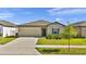 Inviting single-Gathering home with a manicured lawn and an attached two-car garage at 5857 Beefmaster Rd, St Cloud, FL 34771
