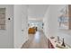 Inviting hallway with decor, seamlessly connecting to the main living area and other rooms at 5857 Beefmaster Rd, St Cloud, FL 34771