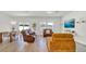 Spacious living area with abundant natural light, showcasing an open floor plan and cozy furnishings at 5857 Beefmaster Rd, St Cloud, FL 34771
