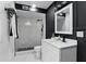 Modern bathroom with a sleek shower and vanity with dark accents and hardware at 606 Faber Dr, Orlando, FL 32822