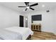 Bright bedroom with ceiling fan and comfortable bed with wood floors and lots of light at 606 Faber Dr, Orlando, FL 32822