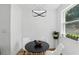Cozy dining area with contemporary lighting, seating, and natural light from the window at 606 Faber Dr, Orlando, FL 32822
