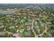 Aerial community view highlights mature trees, tennis courts, and swimming pools, perfect for outdoor enthusiasts at 6088 Westgate Dr # 201, Orlando, FL 32835