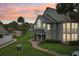 Charming townhouse exterior with lush landscaping, pool access, and serene sunset view at 6088 Westgate Dr # 201, Orlando, FL 32835