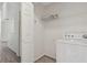 Convenient laundry room with modern appliances and storage, designed for efficient home upkeep at 6088 Westgate Dr # 201, Orlando, FL 32835