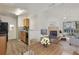 Bright, open-concept living and dining area featuring a cozy fireplace and modern furnishings at 6088 Westgate Dr # 201, Orlando, FL 32835