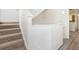 Carpeted staircase with freshly painted walls, adding a clean, inviting feel to the home's interior at 6088 Westgate Dr # 201, Orlando, FL 32835