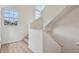 Bright staircase with a large window provides natural light, enhancing the home's airy and open feel at 6088 Westgate Dr # 201, Orlando, FL 32835