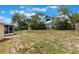 Spacious backyard showcasing the home's outdoor space, greenery, and partially fenced yard at 622 N Goodrich Dr, Deltona, FL 32725