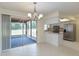 Dining area adjacent to the kitchen with sliding door access to the backyard at 622 N Goodrich Dr, Deltona, FL 32725