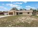 Charming single-story home with a well-manicured front yard and a two-car garage at 622 N Goodrich Dr, Deltona, FL 32725