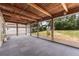 View of the bright sunroom with wood beam ceiling and view of the backyard at 622 N Goodrich Dr, Deltona, FL 32725