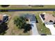 Aerial view of the house displaying the driveway and surrounding landscape at 6741 Heavitree Dr, Sebring, FL 33876
