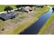 An aerial view showcases the home's backyard and proximity to a scenic waterway at 6741 Heavitree Dr, Sebring, FL 33876