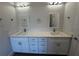 Modern bathroom features double sinks with modern fixtures, a vanity and quartz countertops at 6741 Heavitree Dr, Sebring, FL 33876