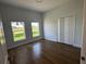Bedroom featuring a closet and windows with a view of the outdoors, filled with natural light at 6741 Heavitree Dr, Sebring, FL 33876