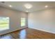 Light-filled bedroom featuring hardwood floors and recessed lighting at 6741 Heavitree Dr, Sebring, FL 33876