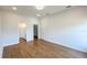 Spacious bedroom with hardwood floors, and an en-suite bathroom at 6741 Heavitree Dr, Sebring, FL 33876